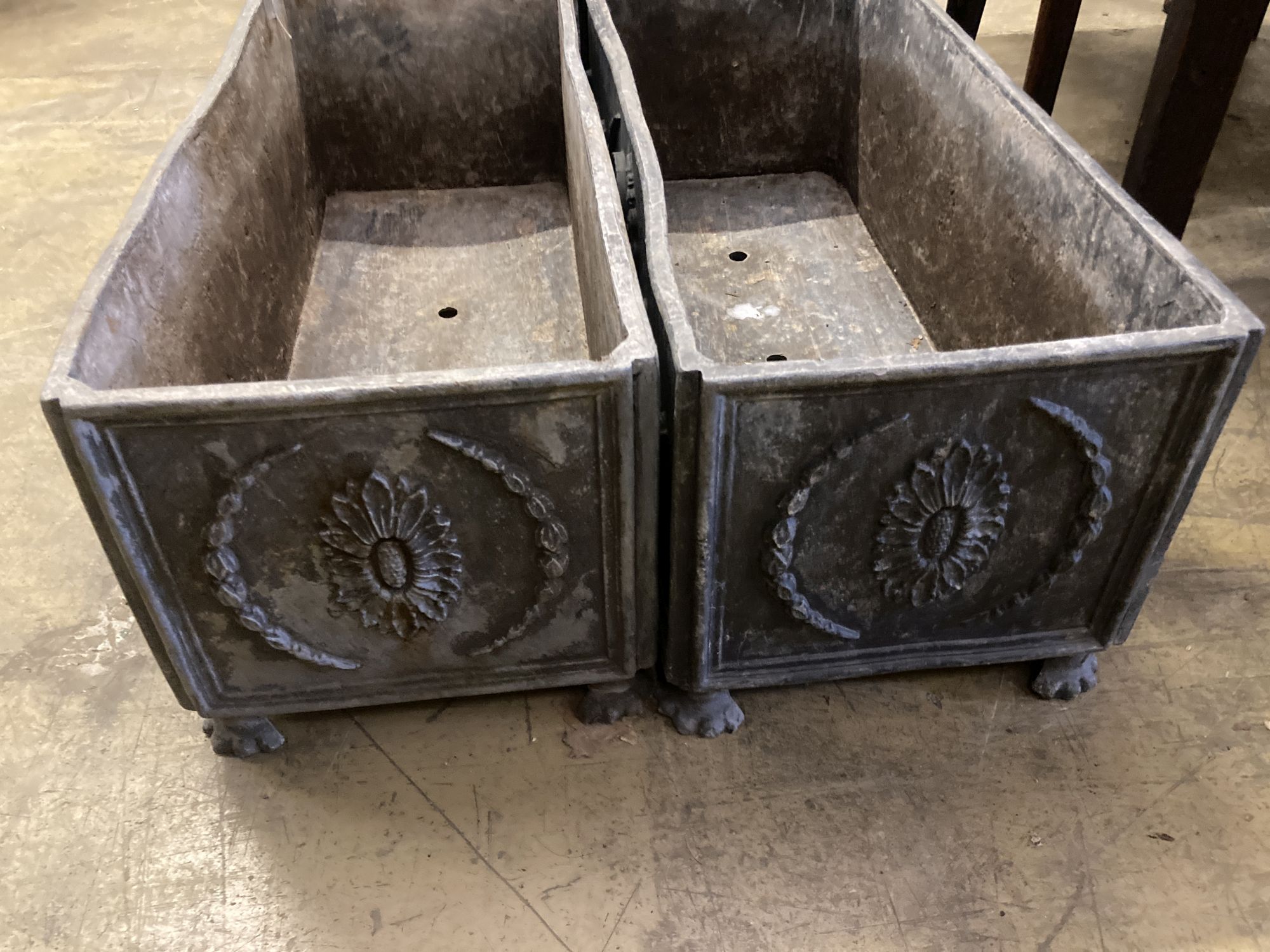 A pair of rectangular lead garden planters, width 60cm, depth 24cm, height 23cm